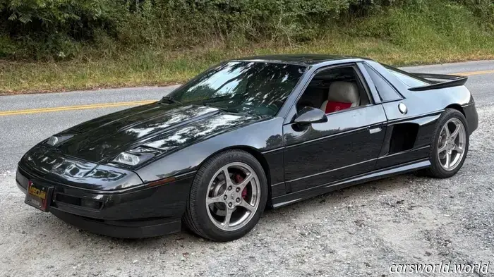 Someone elongated this Pontiac Fiero to accommodate a Cadillac V8 lengthwise.