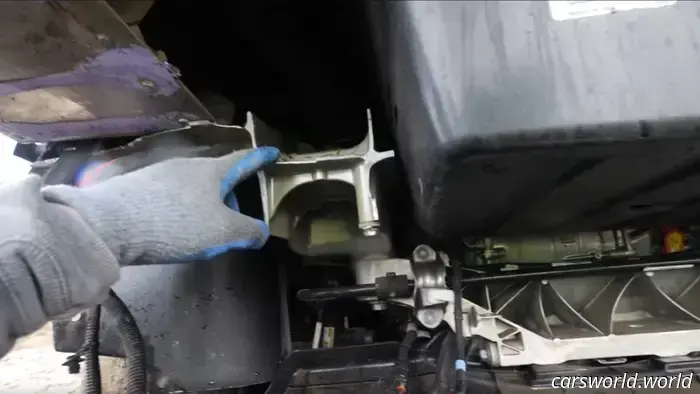 Observe a Tesla Cybertruck being dismantled during a tow hitch stress examination.