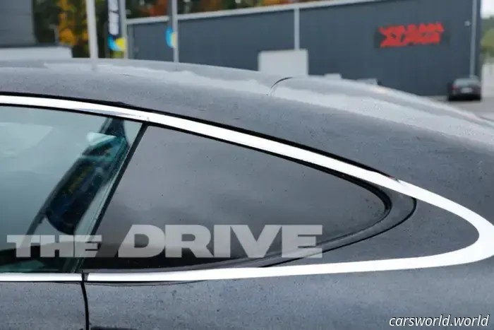 Porsche’s camouflage strategy to conceal the Cayman EV’s rear window is somewhat amusing.