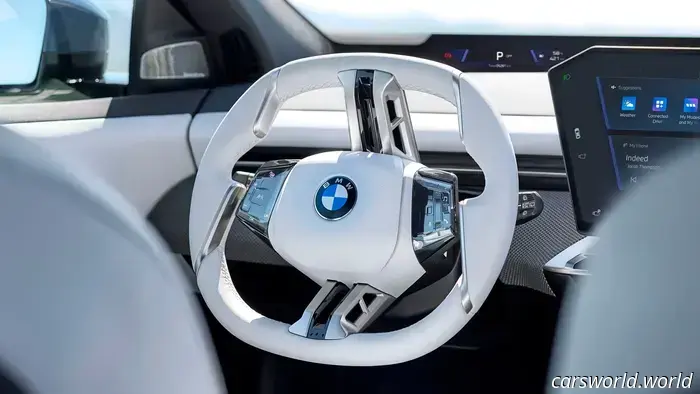 BMW has eliminated the iDrive knob in favor of haptic controls and a full-width display.