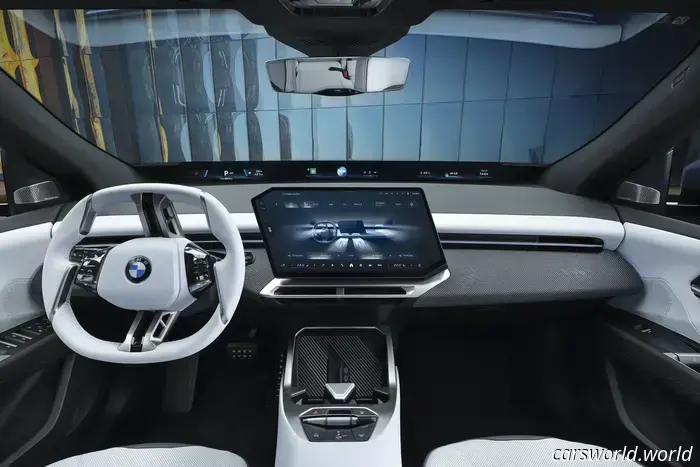 BMW has eliminated the iDrive knob in favor of haptic controls and a full-width display.