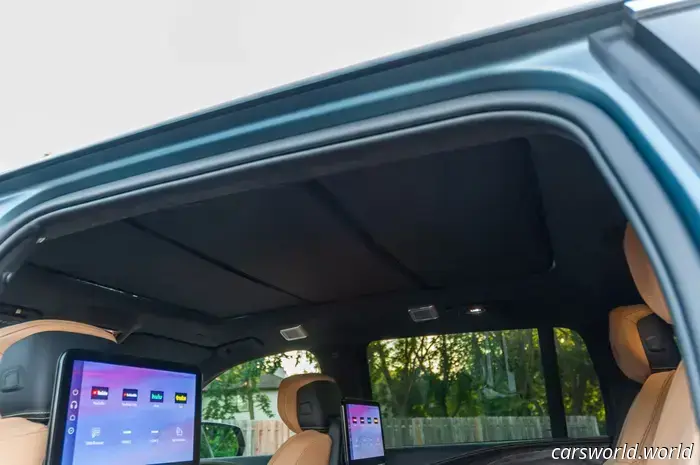 The Cadillac Escalade IQ, priced at $130,000, features a cloth roof sunshade that can be installed by the user.