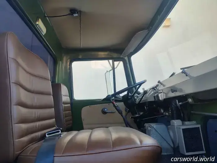 This 1959 IH Semi Truck available for sale features windshields positioned below the driver's knees.