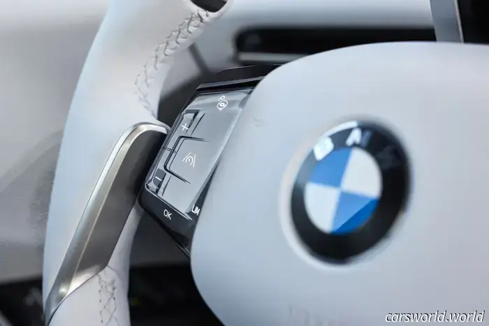 BMW has eliminated the iDrive knob in favor of haptic controls and a full-width display.