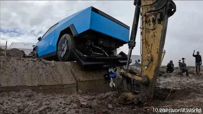 Observe a Tesla Cybertruck being dismantled during a tow hitch stress examination.