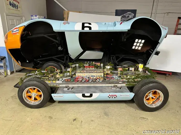 This 1969 Ford GT40 race car features a hidden slot car track within.