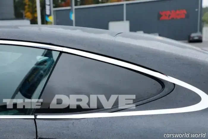 Porsche’s camouflage strategy to conceal the Cayman EV’s rear window is somewhat amusing.