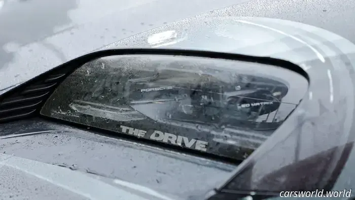 Porsche’s camouflage strategy to conceal the Cayman EV’s rear window is somewhat amusing.